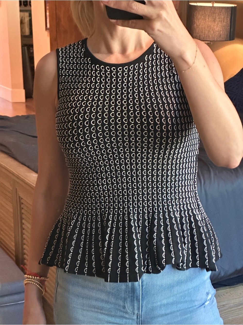 Women’s Black & White Sleeveless Peplum Knit Top